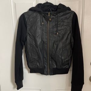 Black half Leather half jacket material. Super cute also keeps you warm!